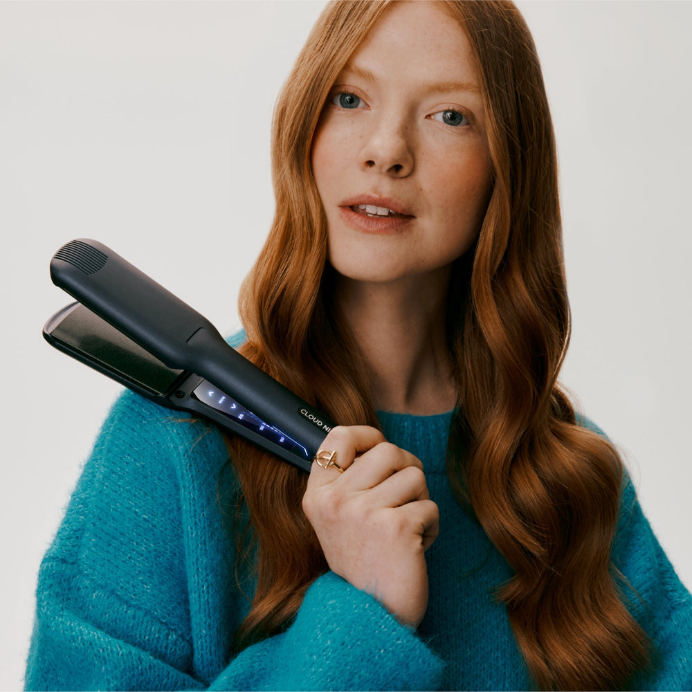 Woman holding Cloud Nine Contouring Wide Iron 